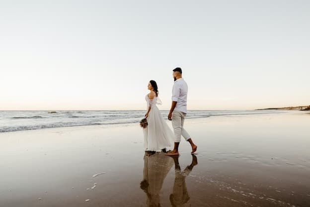 Romantic couple stroll on tranquil shoreline